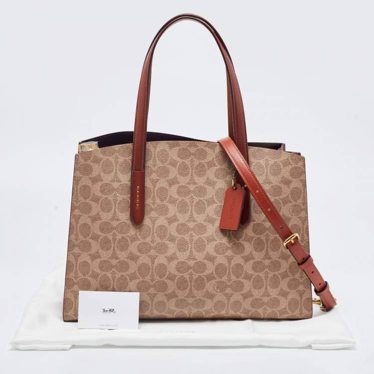 Pre Owned Coach Beige/Brown Signature Coated Canvas and Leather City Zip Tote