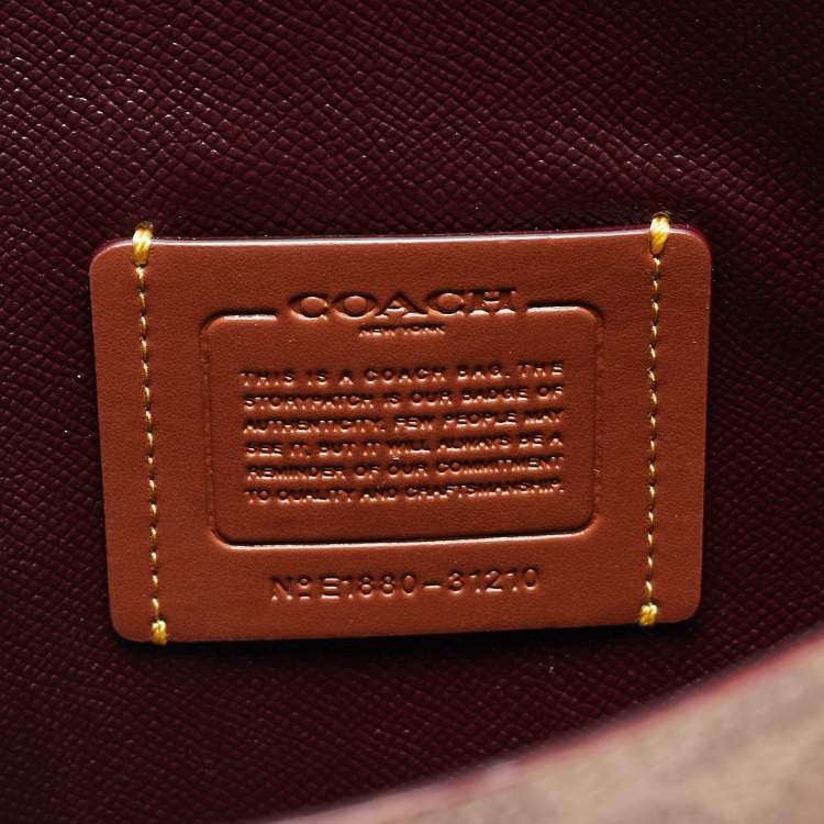 Pre Owned Coach Beige/Brown Signature Coated Canvas and Leather City Zip Tote