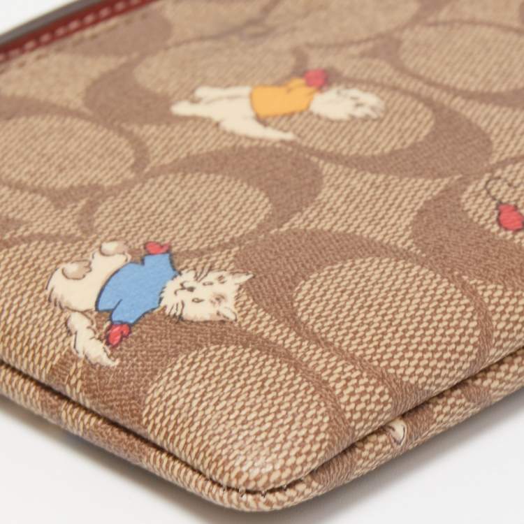 Pre Owned Coach Beige Signature Coated Canvas Cat Mittens Zip Wristlet Pouch