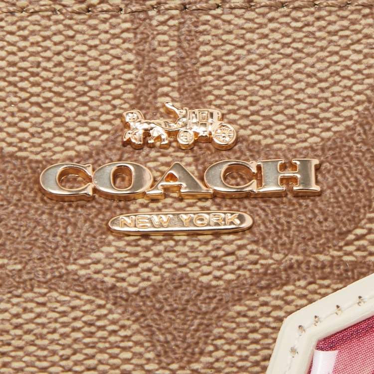 Pre Owned Coach Beige/Old Rose Signature Coated Canvas and Leather Disco Patch Wristlet Pouch