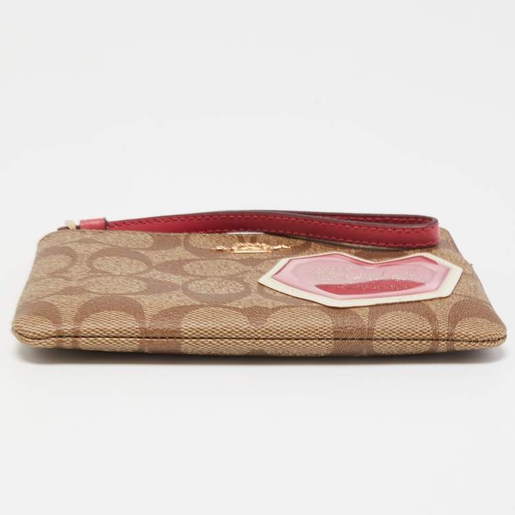 Pre Owned Coach Beige/Old Rose Signature Coated Canvas and Leather Disco Patch Wristlet Pouch