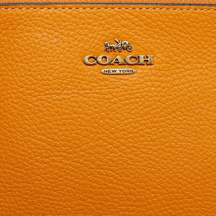 Pre Owned Coach Orange Leather Wristlet Zip Pouch