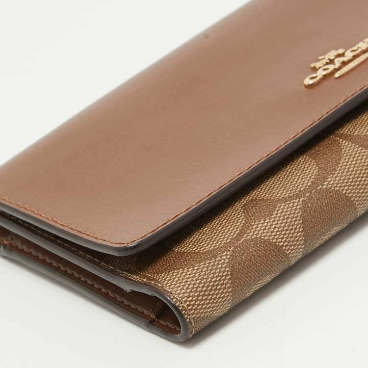Pre Owned Coach Brown/Beige Signature Coated Canvas and Leather Trifold Long Wallet