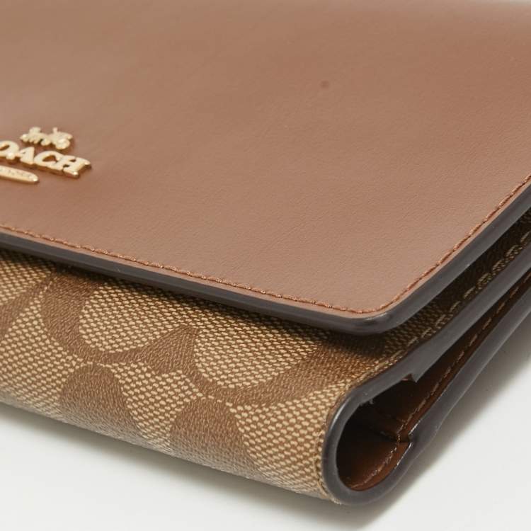 Pre Owned Coach Brown/Beige Signature Coated Canvas and Leather Trifold Long Wallet
