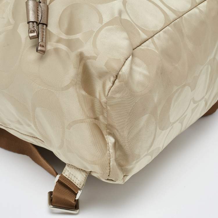 Pre Owned Coach Beige/Metallic Signature Nylon and Leather Backpack