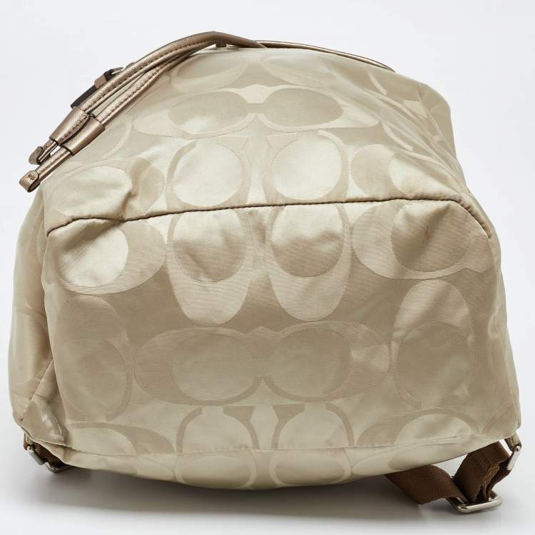 Pre Owned Coach Beige/Metallic Signature Nylon and Leather Backpack