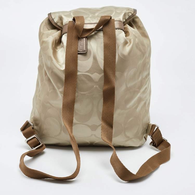 Pre Owned Coach Beige/Metallic Signature Nylon and Leather Backpack