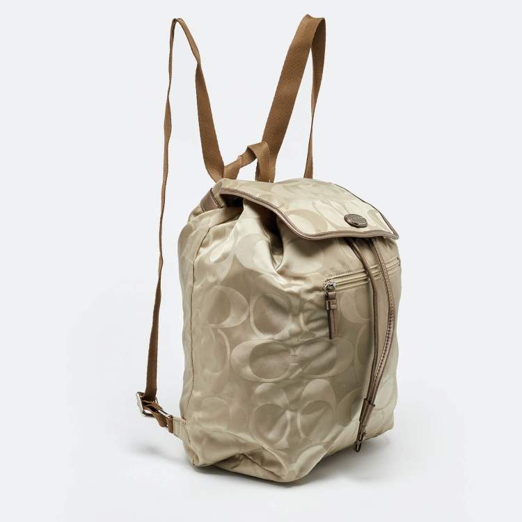 Pre Owned Coach Beige/Metallic Signature Nylon and Leather Backpack
