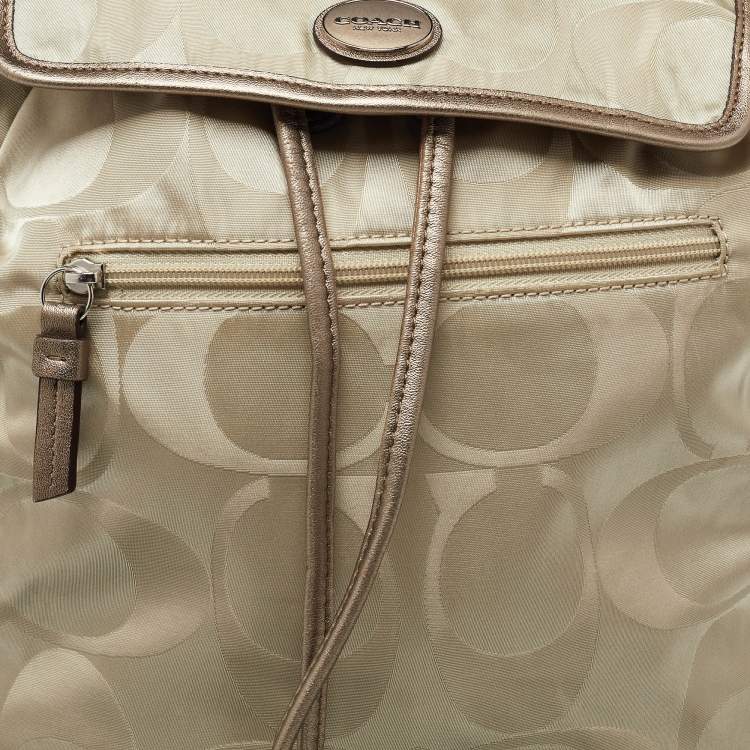 Pre Owned Coach Beige/Metallic Signature Nylon and Leather Backpack