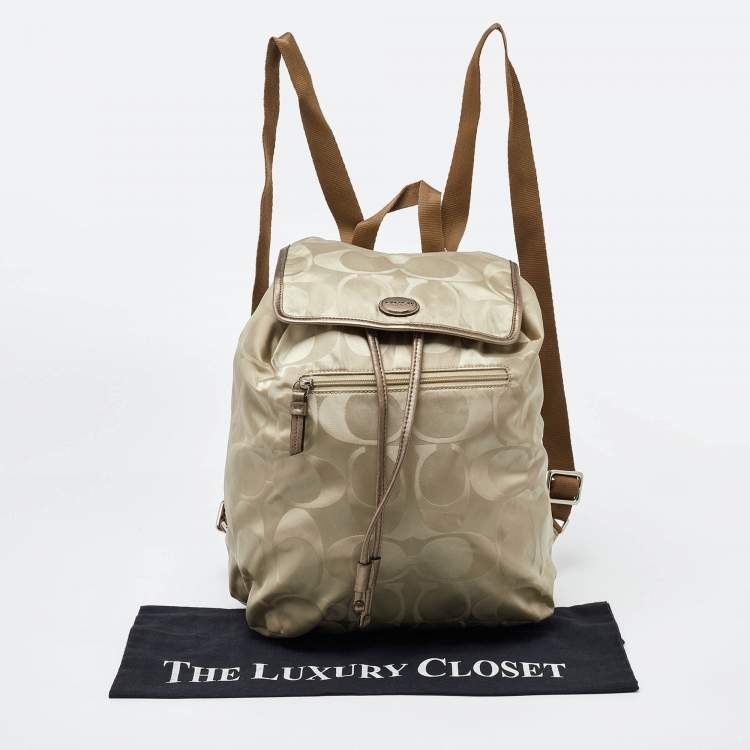Pre Owned Coach Beige/Metallic Signature Nylon and Leather Backpack