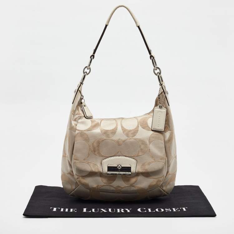 Pre Owned Coach Beige Signature Fabric Kristine Hobo