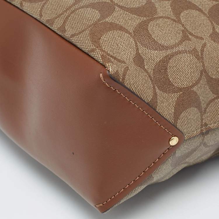 Pre Owned Coach Brown/Beige Signature Coated Canvas Abby Duffle Shoulder Bag