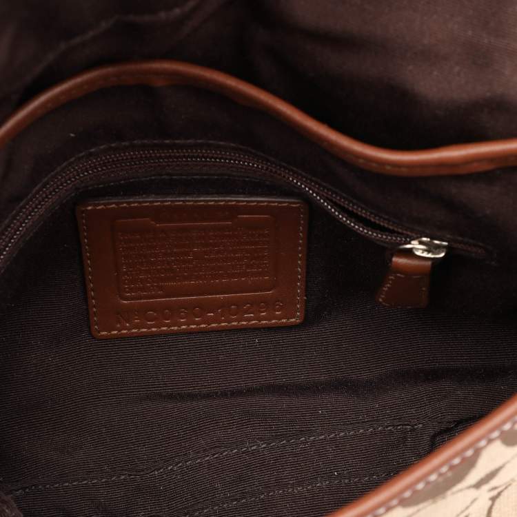 Pre Owned Coach Beige/Brown Signature Canvas Soho Vintage Flap Shoulder Bag