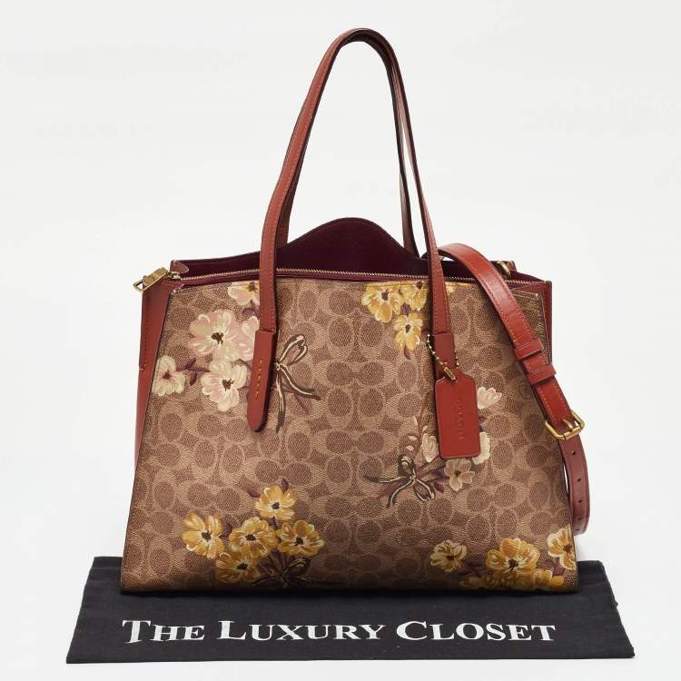 Pre Owned Coach Brown Prairie Floral Signature Coated Canvas and Leather Charlie Carryall Tote