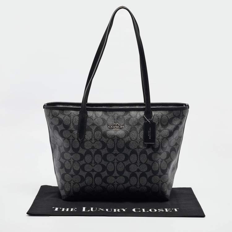 Pre Owned Coach Black/Silver Signature Coated Canvas and Leather City Zip Tote