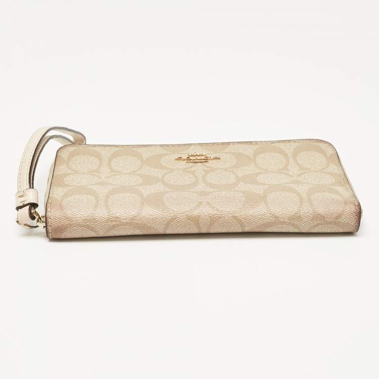 Pre Owned Coach Beige Siganture Coated Canvas and Leather Zip Around Wristlet Wallet