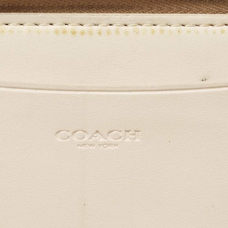 Pre Owned Coach Beige Siganture Coated Canvas and Leather Zip Around Wristlet Wallet