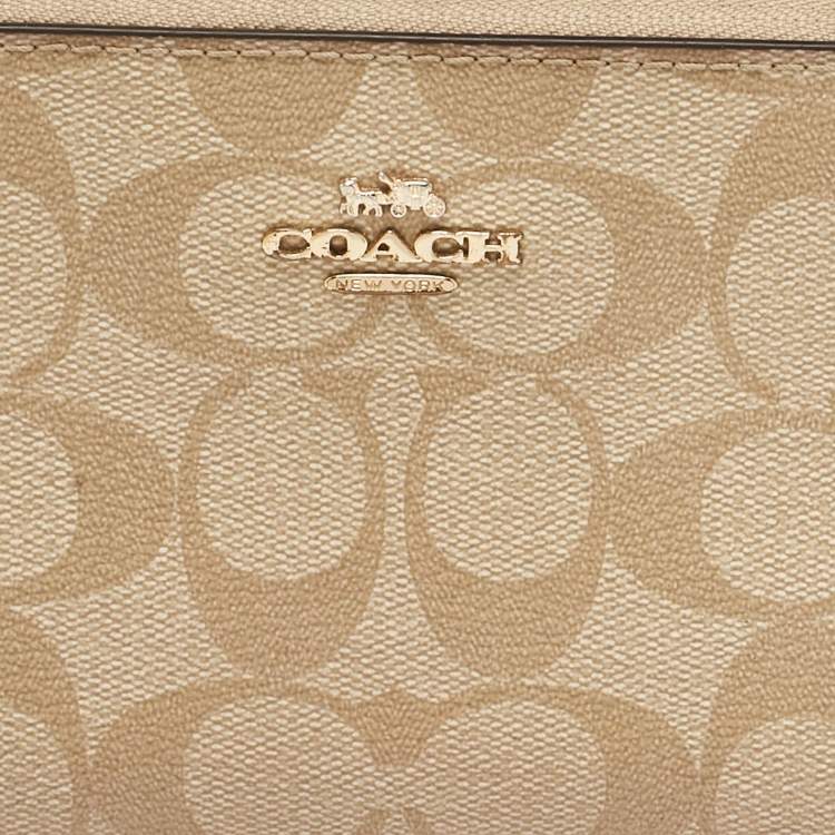 Pre Owned Coach Beige Siganture Coated Canvas and Leather Zip Around Wristlet Wallet