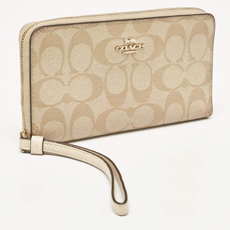 Pre Owned Coach Beige Siganture Coated Canvas and Leather Zip Around Wristlet Wallet