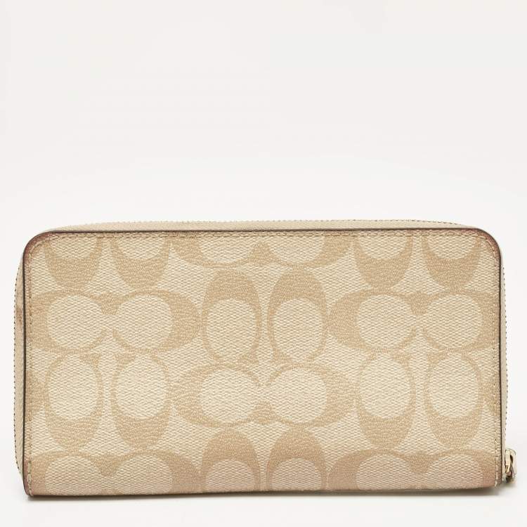 Pre Owned Coach Beige Siganture Coated Canvas and Leather Zip Around Wristlet Wallet