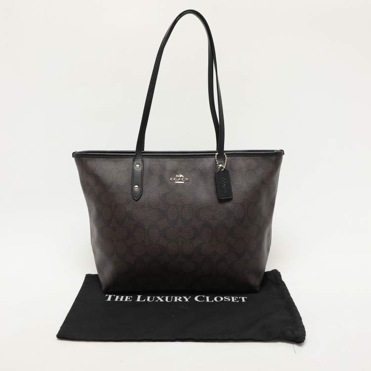 Pre Owned Coach Black/Brown Signature Coated Canvas and Leather City Zip Tote