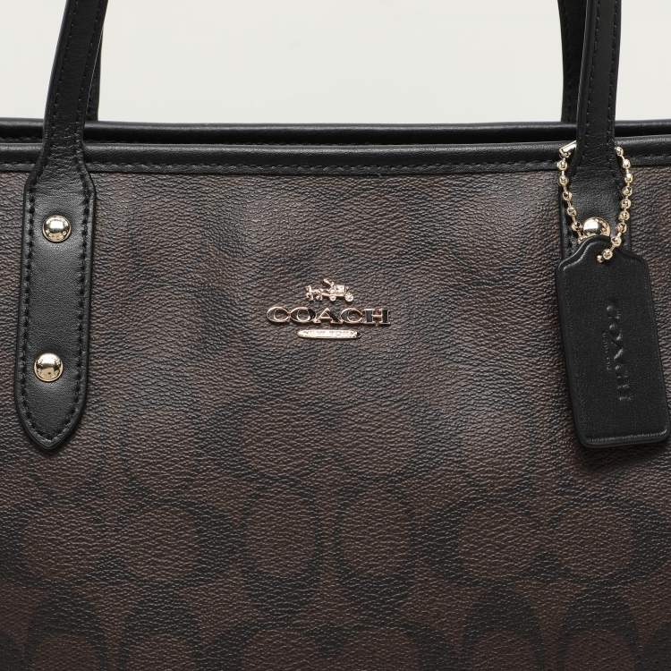 Pre Owned Coach Black/Brown Signature Coated Canvas and Leather City Zip Tote