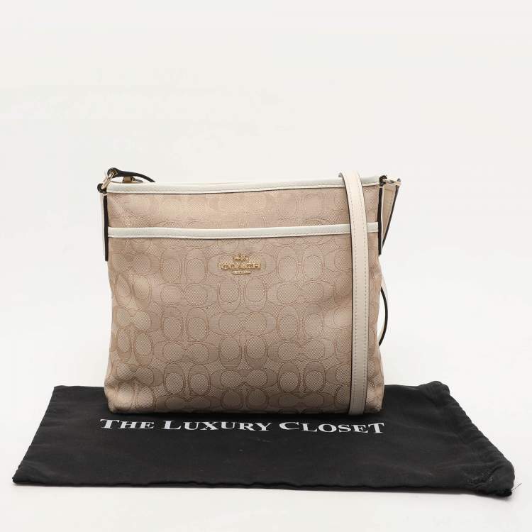 Pre Owned Coach Beige/White Signature Canvas and Leather Swingpack File Crossbody Bag