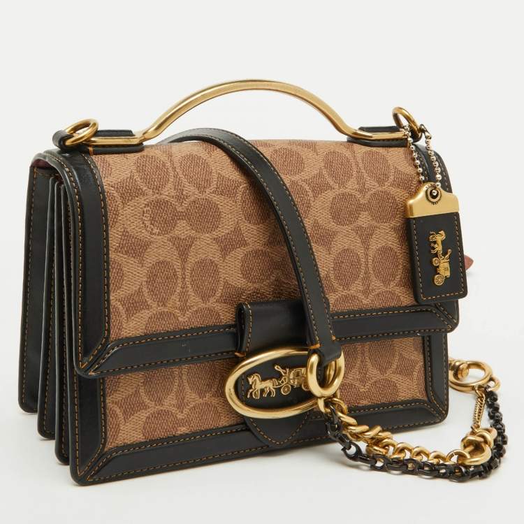 Pre Owned Coach Beige/Black Signature Coated Canvas and Leather Riley 22 Top Handle Bag