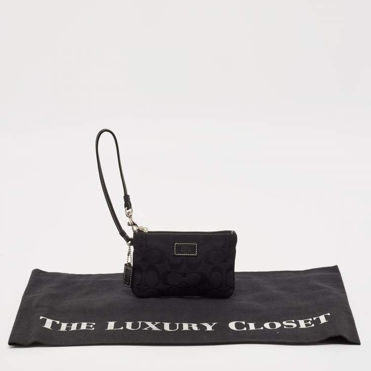 Pre Owned Coach Black Signature Canvas and Leather Wristlet Clutch