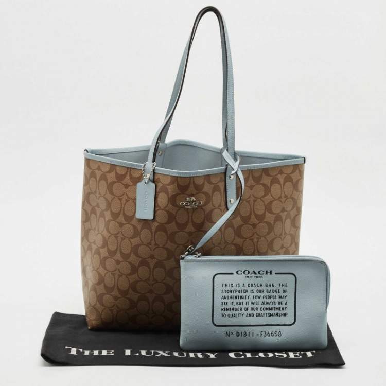 Pre Owned Coach Brown/Light Blue Signature Coated Canvas Reversible City Tote