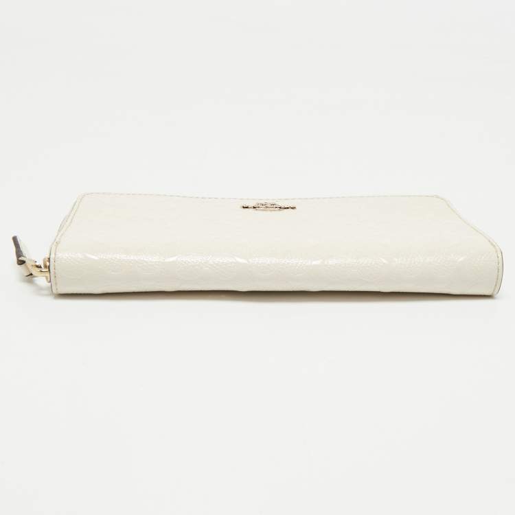 Pre Owned Coach White Signature Embossed Leather Long Zip Around Wallet