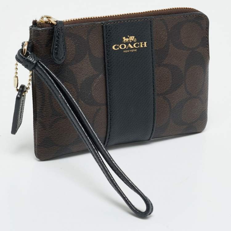 Pre Owned Coach Brown/Black Signature Coated Canvas and Leather Corner Zip Wristlet