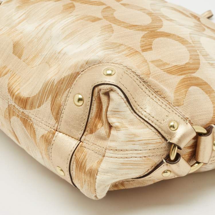 Pre Owned Coach Gold Signature Canvas and Leather Carly Hobo