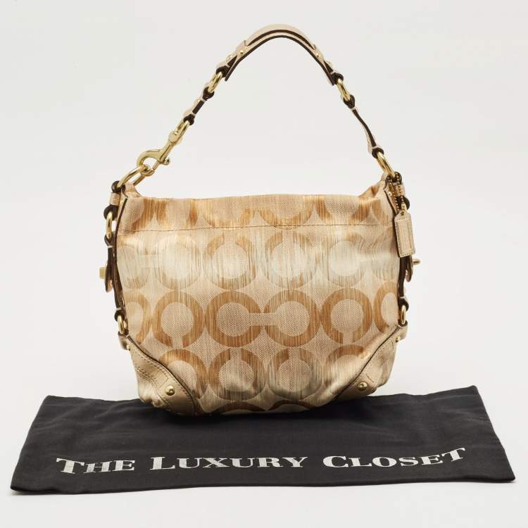 Pre Owned Coach Gold Signature Canvas and Leather Carly Hobo