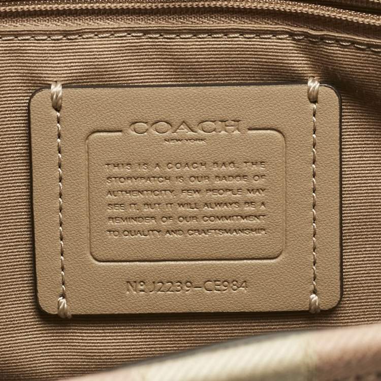 Pre Owned Coach Pale Gold/Beige Signature Jacquard Canvas Dempsey 30 Carryall Tote