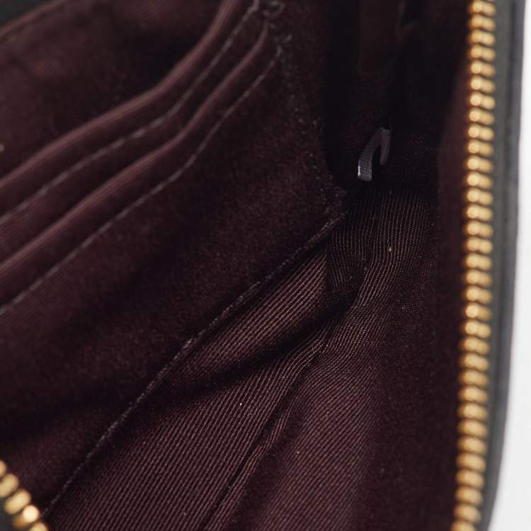 Pre Owned Coach Black Signature Embossed Leather Zip Wristlet