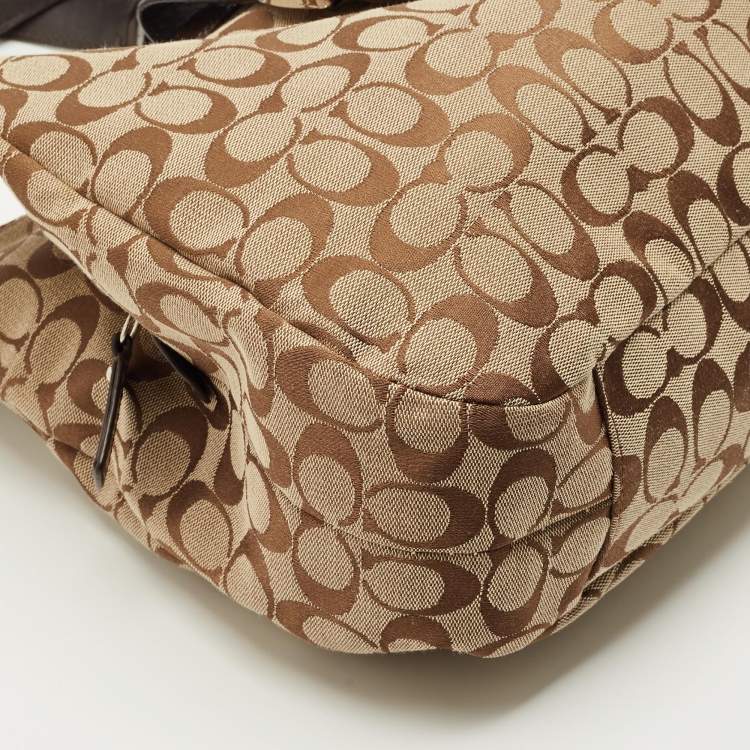 Pre Owned Coach Beige/Brown Signature Canvas and Leather Soho Lynn Hobo