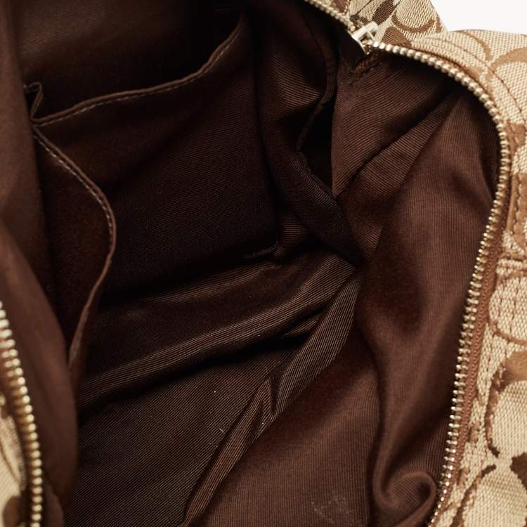 Pre Owned Coach Beige/Brown Signature Canvas and Leather Soho Lynn Hobo