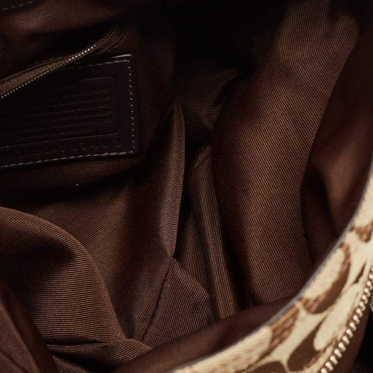 Pre Owned Coach Beige/Brown Signature Canvas and Leather Soho Lynn Hobo