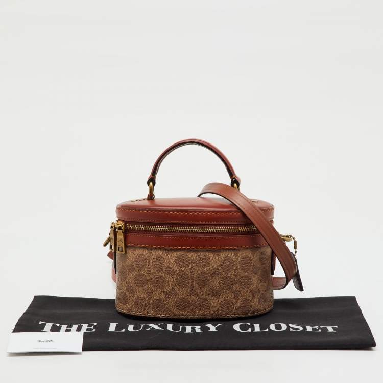 Pre Owned Coach Beige/Brown Signature Coated Canvas and Leather Trail Top Handle Bag
