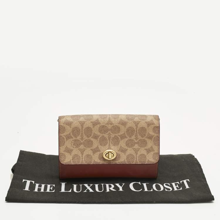 Pre Owned Coach Brown/Beige Signature Coated Canvas and Leather Marlow Clutch Bag