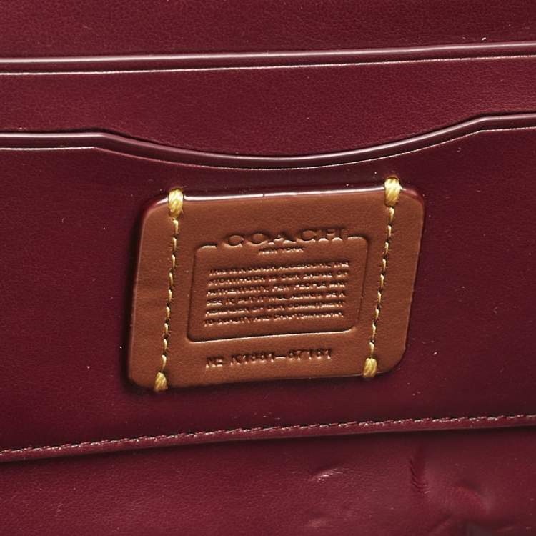 Pre Owned Coach Brown/Beige Signature Coated Canvas and Leather Marlow Clutch Bag
