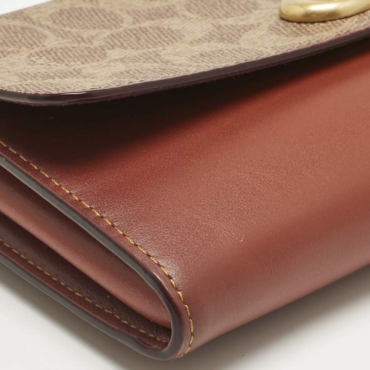 Pre Owned Coach Brown/Beige Signature Coated Canvas and Leather Marlow Clutch Bag