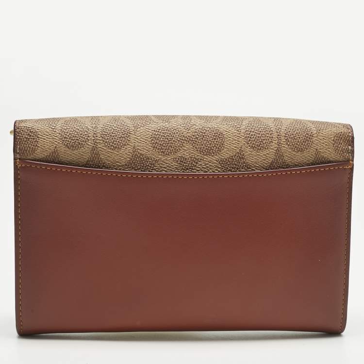 Pre Owned Coach Brown/Beige Signature Coated Canvas and Leather Marlow Clutch Bag