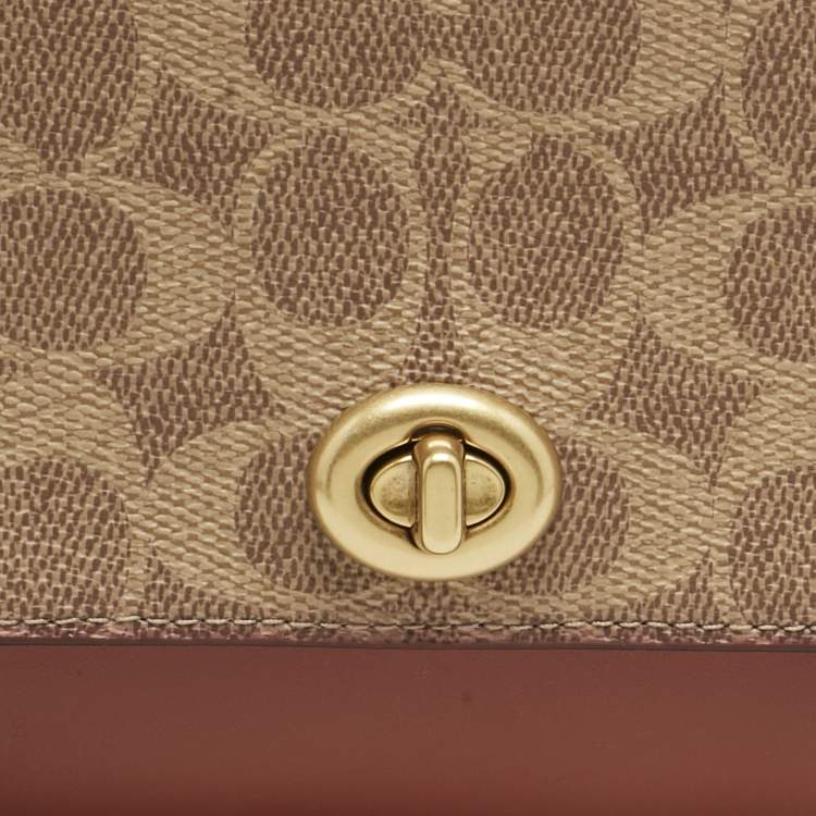 Pre Owned Coach Brown/Beige Signature Coated Canvas and Leather Marlow Clutch Bag