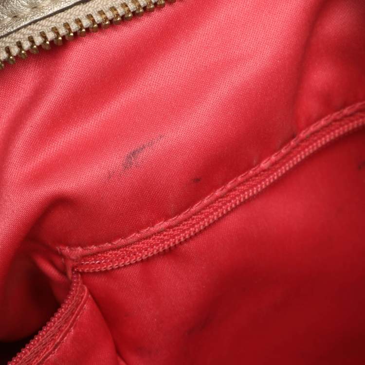 Pre Owned Coach Beige/Gold Canvas and Leather Zoe Hobo