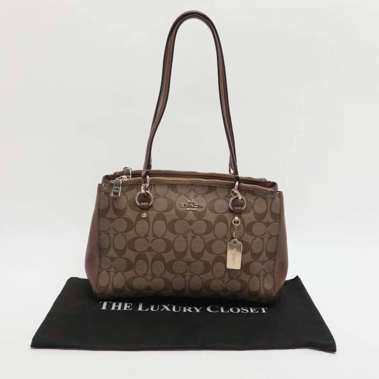 Pre Owned Coach Etta Carryall Beige/Brown Signature Coated Canvas and Leather Satchel