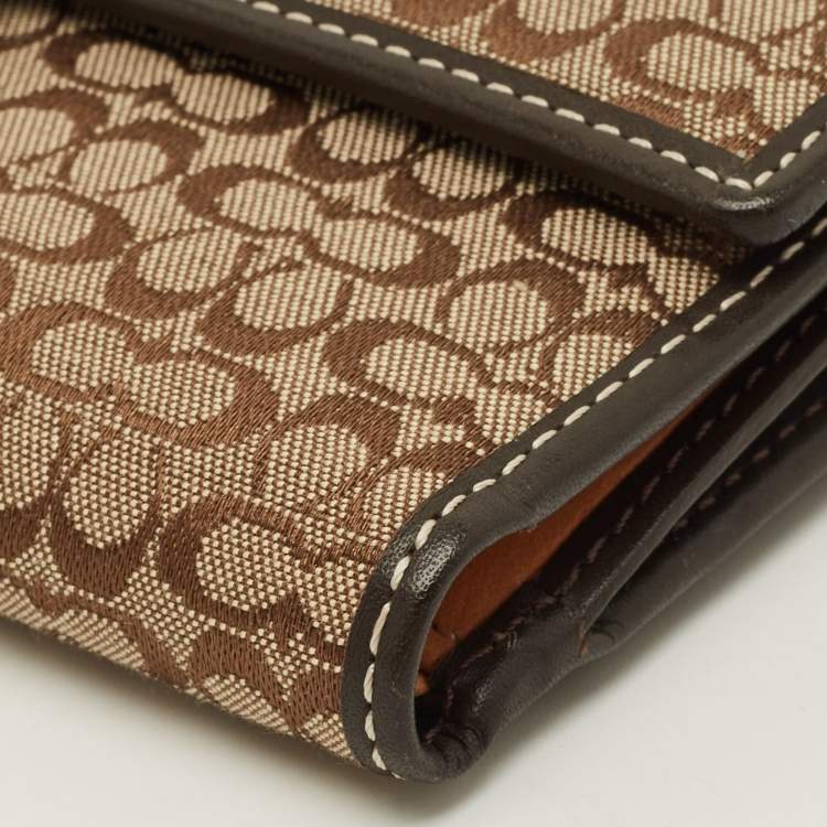 Pre Owned Coach Buckle Beige/Brown Signature Fabric and Leather Trifold Wallet