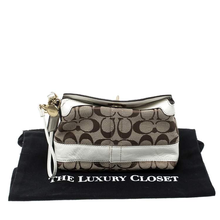 Pre Owned Coach Beige/White Signature Canvas Wristlet Pouch