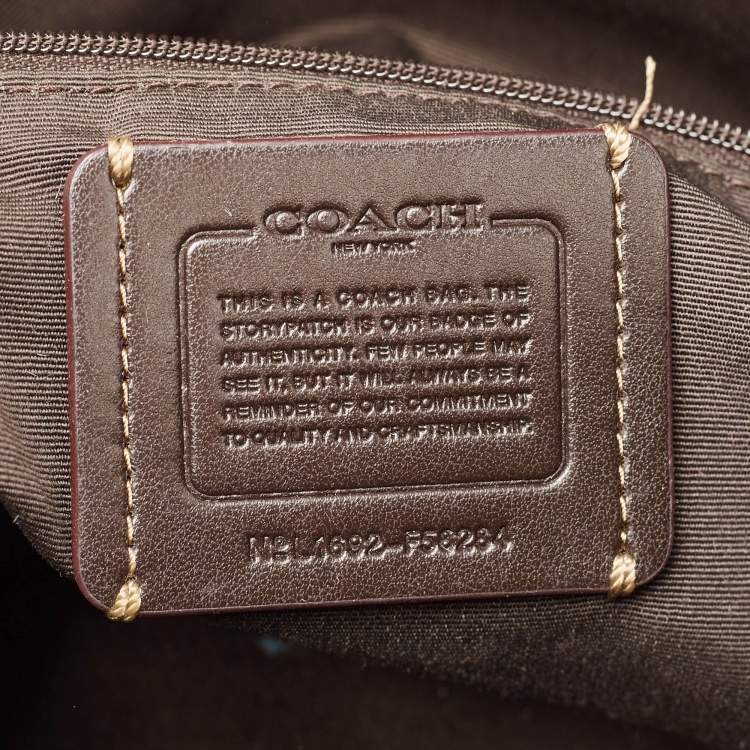 Pre Owned Coach Beige Signature Canvas East West Celeste Hobo
